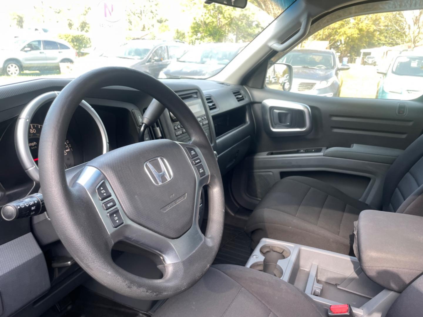 2007 SILVER HONDA RIDGELINE RTS (2HJYK16467H) with an 3.5L engine, Automatic transmission, located at 5103 Dorchester Rd., Charleston, SC, 29418-5607, (843) 767-1122, 36.245171, -115.228050 - Clean & Spacious Interior with 6-Disc CD/AUX/Sat, Dual Climate Control, Power Everything (windows, locks, seats, mirrors), All-weather Mats, Keyless Entry, Tow Package, Alloy Wheels. Clean CarFax (no accidents reported!) Local Trade-in!! 146k miles Located at New Life Auto Sales! 2023 WINNER for Po - Photo#18